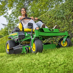 Zero Turn Mower cutting alongside hedge