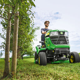 Mowing tractor in an orchard
