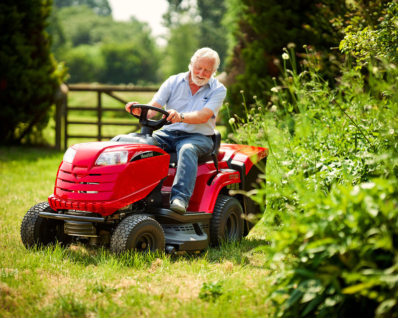 Man mowing lawn on a Mountfield lawn mower