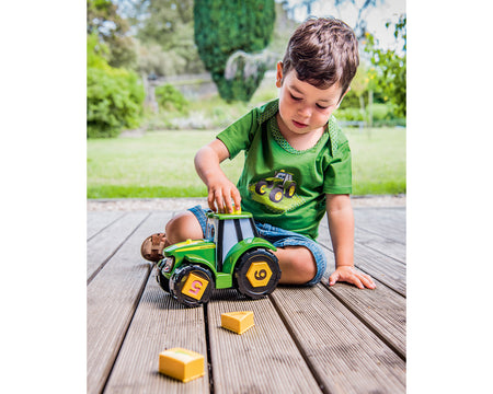 Child playing with John Deere Johnny Tractor Learn & Play MCE46654X000
