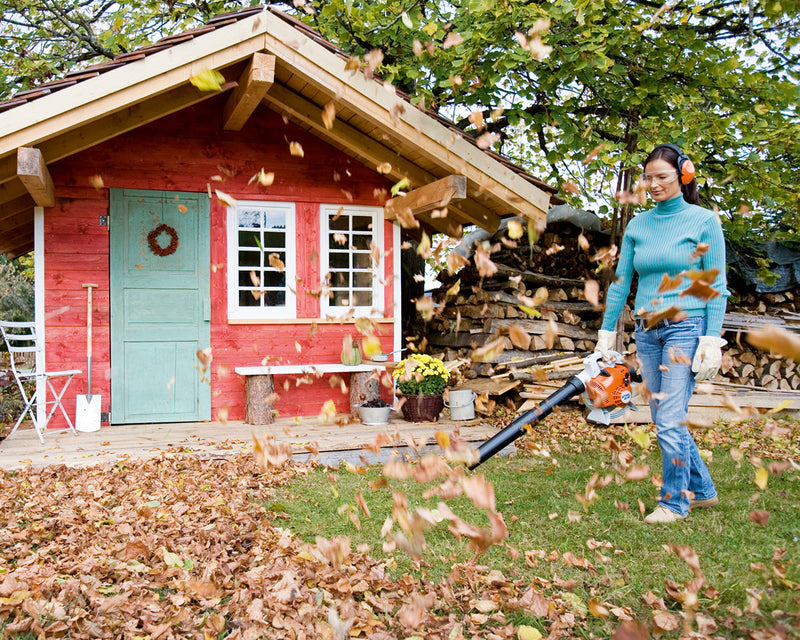 BG 56 Leaf Blower clearing leaves from garden