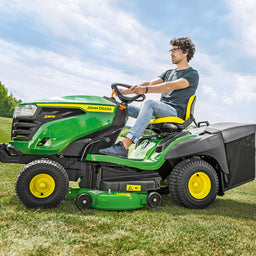 Collecting grass lawn tractor